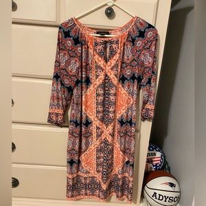 Cute dress! Great material and only worn a couple times. It comes above the knee